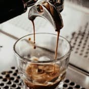 Espresso pouring into a small glass
