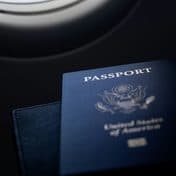 A passport on a dark table